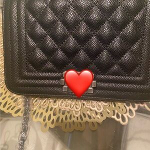 Small black quilted bag just in time for the holiday in great condition!